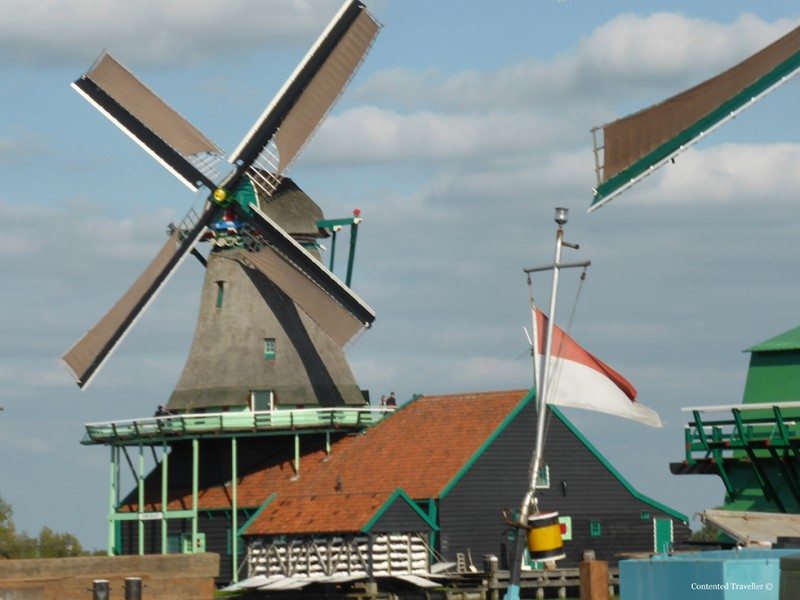 Visit Zaanse Schans to see windmills, clogs and eat cheese.