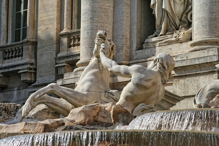 throw a coin in the Trevi Fountain