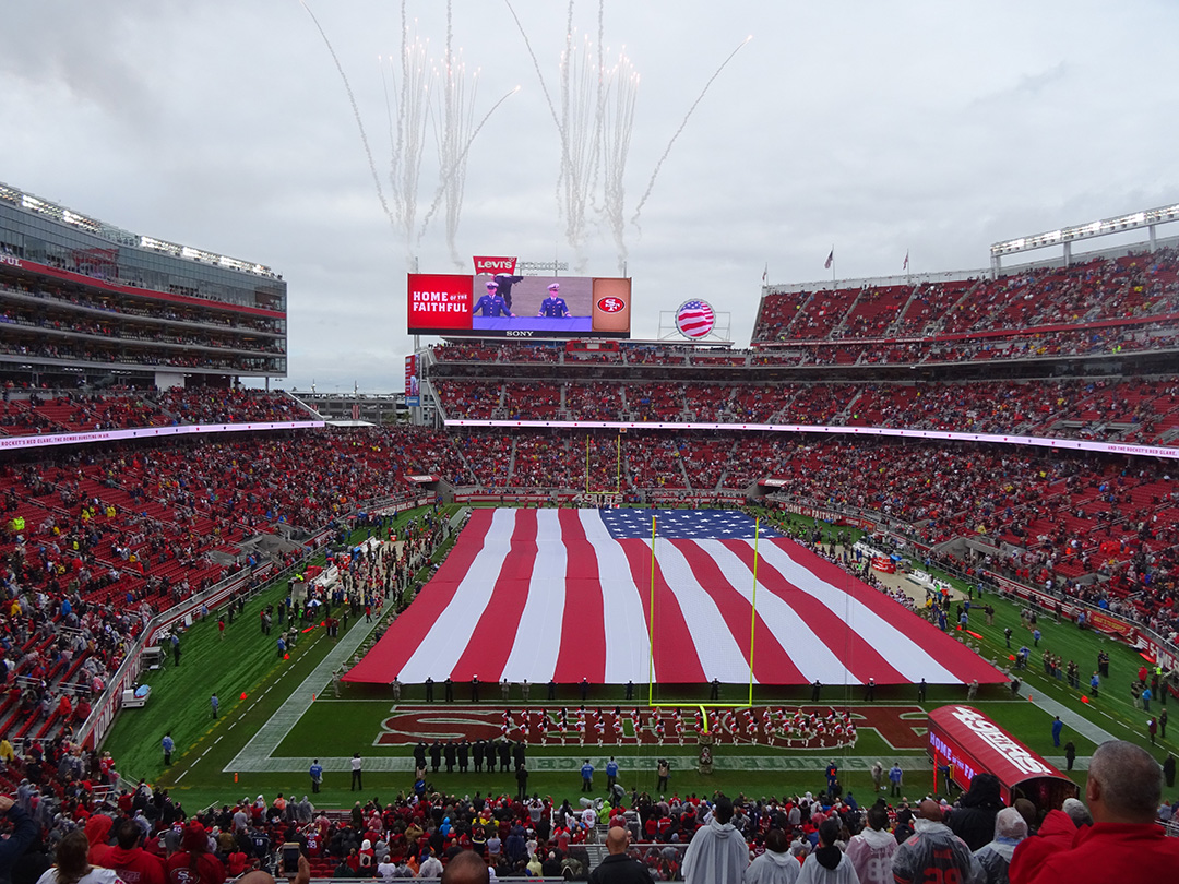 A flag is presented on the field of Levi's Stadium during the